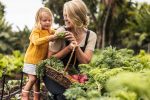 Happy,Single,Mother,Picking,Fresh,Vegetables,With,Her,Daughter.,Cheerful